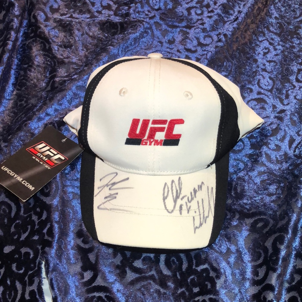 A UFC brand hat signed by chuck lidell and f edger